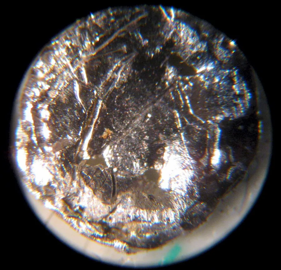 Americium sample. Appearance can vary with surface and storage conditions.