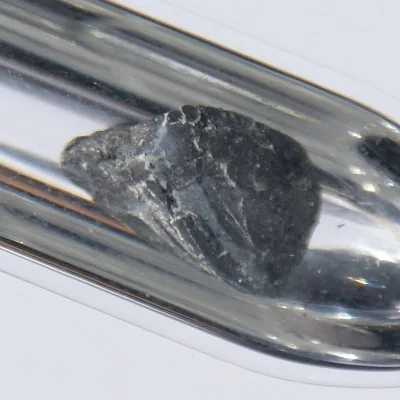 Barium. Appearance depends on surface and storage conditions.