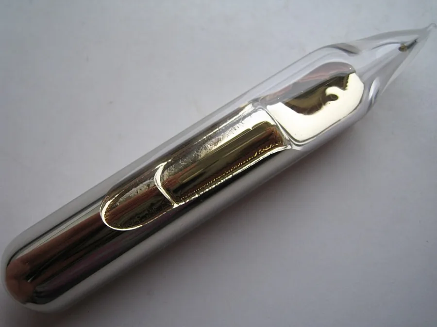 Caesium sample. Appearance can vary with surface and storage conditions.
