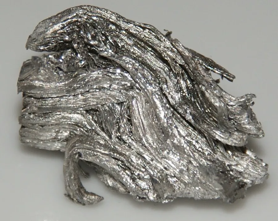 Holmium sample. Appearance can vary with surface and storage conditions.