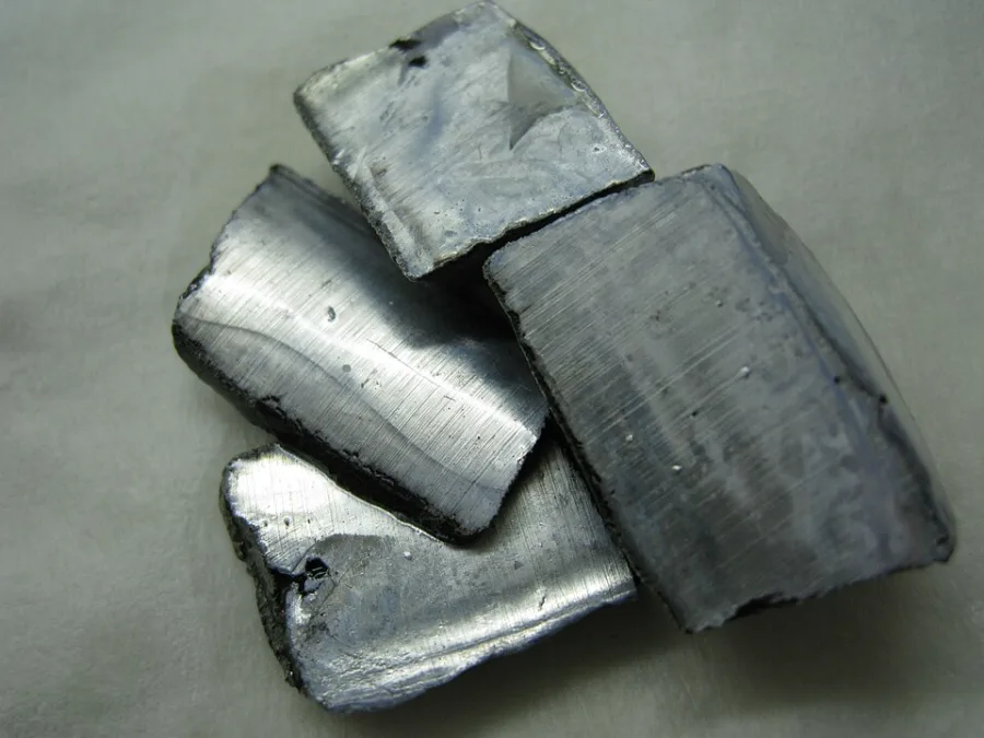 Potassium sample. Appearance can vary with surface and storage conditions.