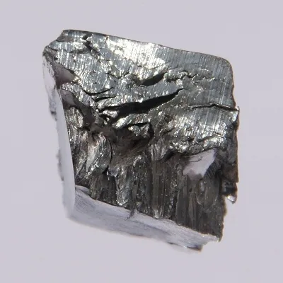Lutetium. Appearance depends on surface and storage conditions.
