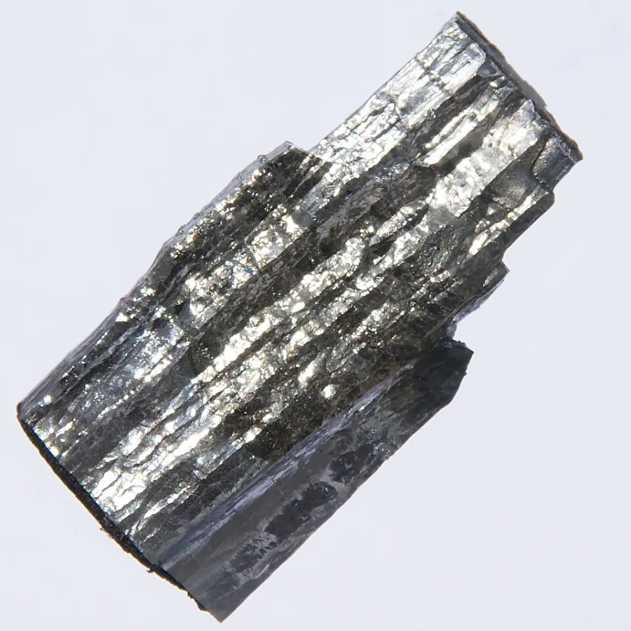 Molybdenum crystals with surface coloration from anodization.