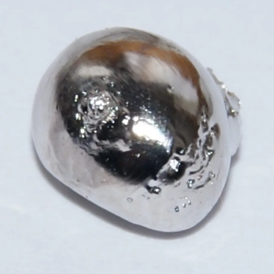 Rhodium sample. Appearance can vary with surface and storage conditions.