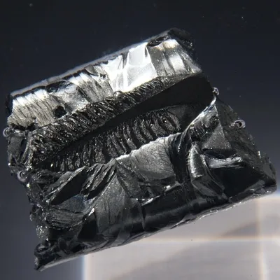 Antimony. Appearance depends on surface and storage conditions.