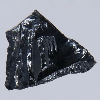 Piece of silicon. Appearance depends on surface and storage conditions.